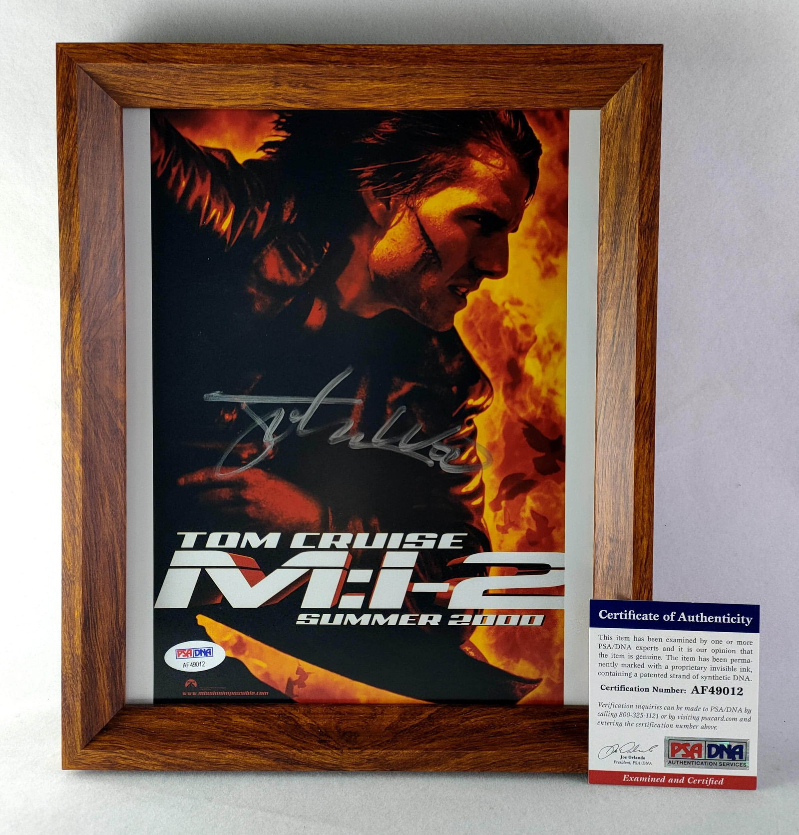 Poster photo of "Mission Impossible 2" by John Woo, the iconic director of Chinese action movies: The poster photo of the film Mission Impossible 2 by John Woo, the iconic director of Chinese action movies (the photo is about 10 inches, with a frame attached). The photo image is a poster photo of 