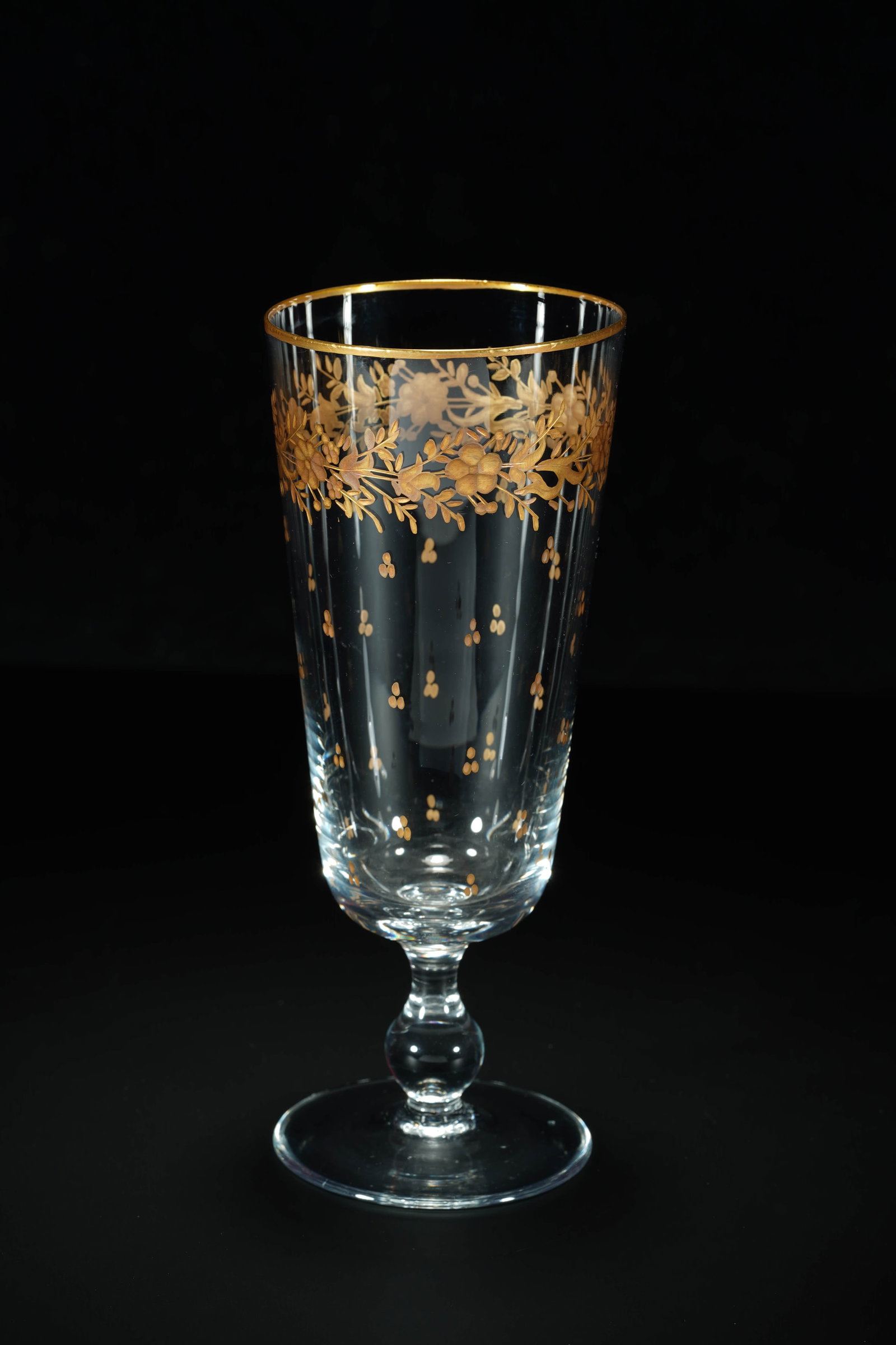 This champagne with a neoclassical crystal carving and flowers painted with gold on the rim. (1 of 9)