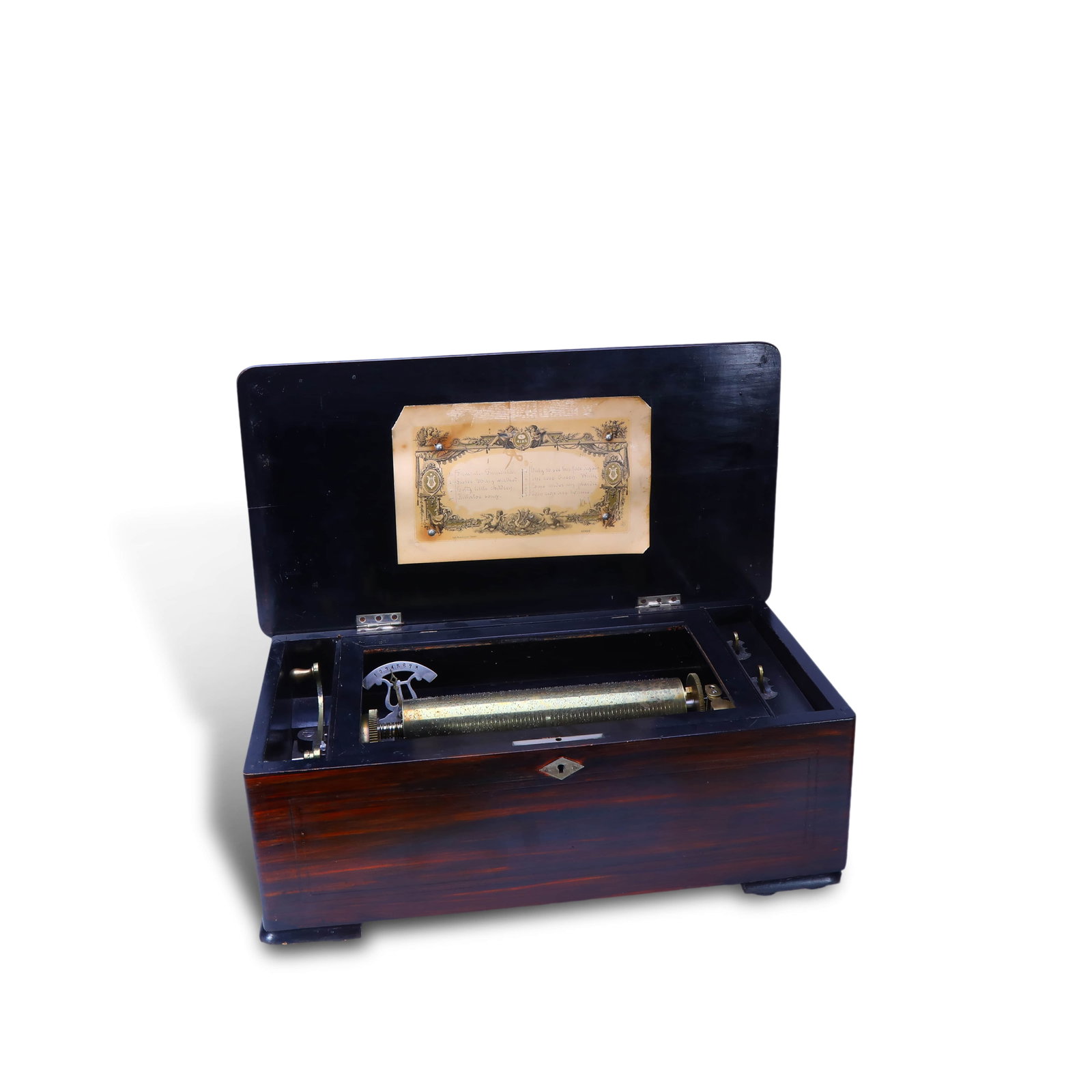Mechanical music box for eight arias.: Name: Mechanical Music Box with Eight Arias"Year: Late 19th centuryMaterial: mahogany, precious wood, ebony, brass.Size: 18 X 46 X 25 cmOrigin: Picard -Lion Music Box Workshop, Geneva, SwitzerlandIntr