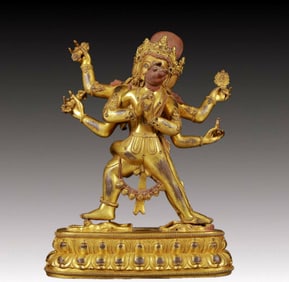 A solemn gilt bronze Vajra statue