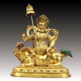 A Solemn Gilt Bronze Statue of Mammon Rides the Lion
