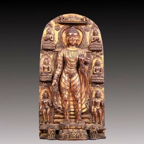 A solemn gilt bronze statue of Sakyamuni