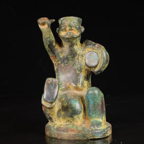 An Archaic Bronze Figure Ornament