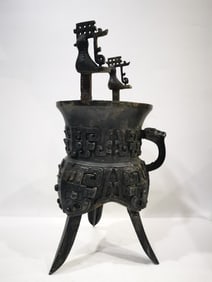An Archaic Bronze Beast-Face Pattern Tripod Food Vessel