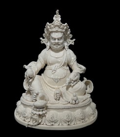 A Solemn Blance-De-Chine Statue of Mammon