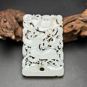 An Exquisite White Jade Auspicious Beast Pendant