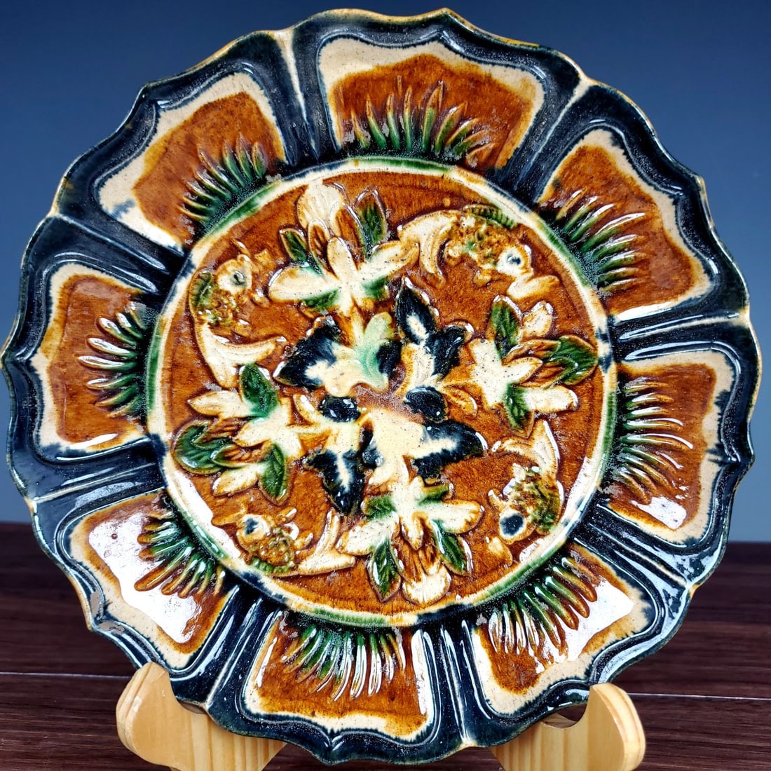 A Rare Tang Tri-Color Glazed Pottery Flower and Fish Pattern Plate: A Rare Tang Tri-Color Glazed Pottery Flower and Fish Pattern Plate,Tang Dynasty,China,Size:1.6inx7.2in 唐三彩花卉鱼纹盘,中国唐代