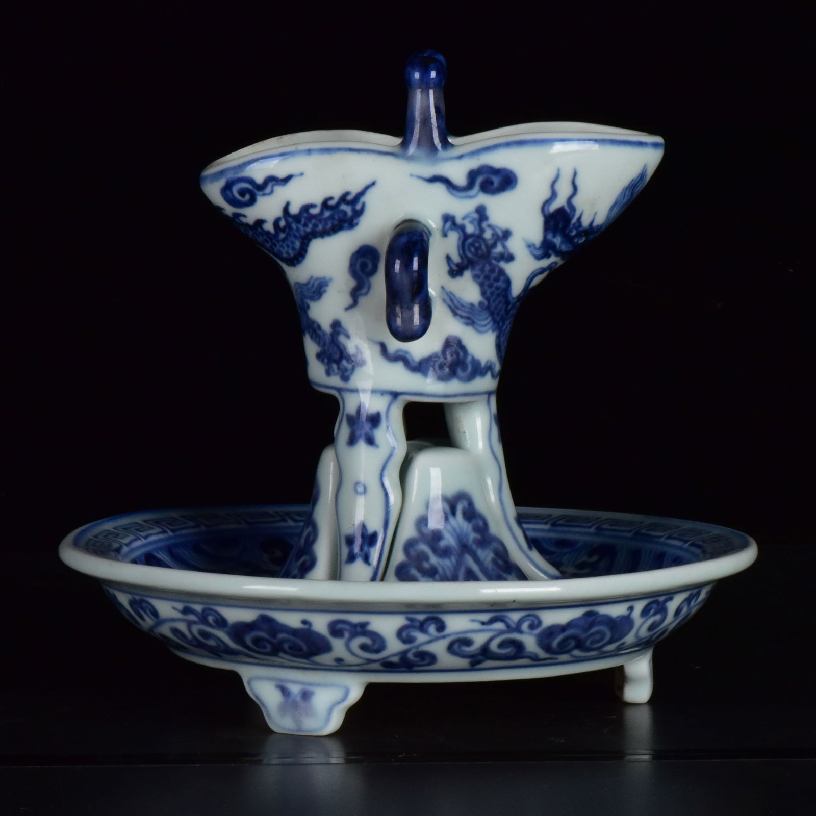 A Set of Fine Blue and White Auspicious Cloud and Dragon Pattern Cups: A Set of Fine Blue and White Auspicious Cloud and Dragon Pattern Cups,Ming Dynasty, China,Xuande Six-Character Mark,Size:(Cup)：5.5inx4.7inx2.6in,(Coaster)2.8inx6.9in 一套青