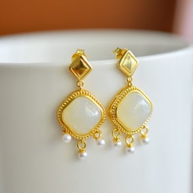 A Pair of Exquisite Sterling Silver-Gold Plated Inlaid White Jade Earrings