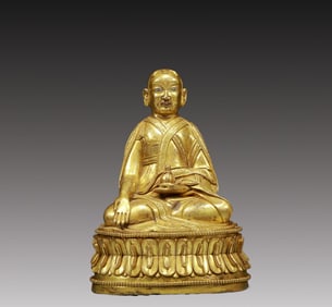 A Solemn Gilt Bronze Statue of Guru