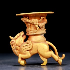 An exquisite gilt bronze cup with auspicious animal patterns