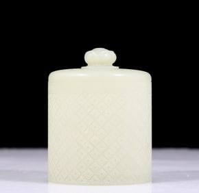 An exquisite white jade jar with floral patterns
