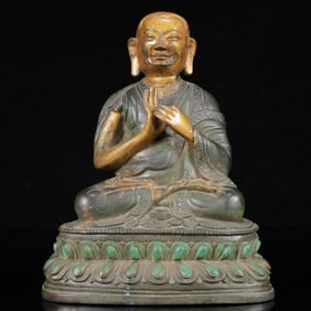 A Solemn Gilt Bronze Statue of Guru