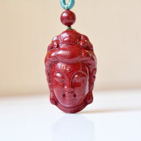 An Exquisite Cinnabar Pendant with Statue of Avalokitesvara Head