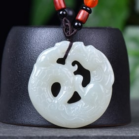 An Exquisite White Jade Dragon Pendant