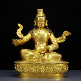 A Solemn Gilt Bronze Statue of Guru