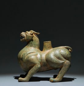 An Archaic Bronze Auspicious Beast Ornament