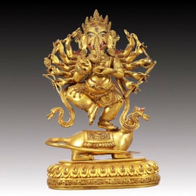 A Solemn Gilt Bronze Statue of Ganesh