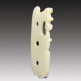 A Rare White Jade Auspicious Beast Pendant