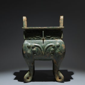 An Archaic Bronze Beast-Face Pattern Double-Ears Ding,with Inscription