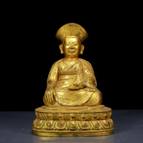 A Solemn Gilt Bronze Statue of Guru