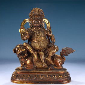 A Solemn Gilt Bronze Statue of Mammon Rides the Lion