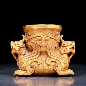 An exquisite gilt bronze cup with auspicious animal patterns