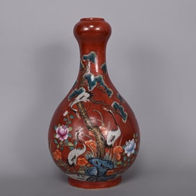 An Exquisite Red Ground Famille-Rose Pine and Crane Pattern Vase