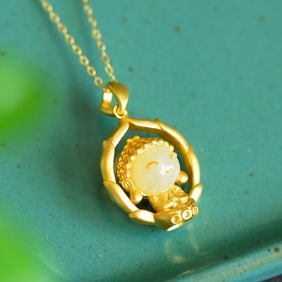 An Exquisite Sterling Silver-Gold Plated Inlaid White Jade Pendant