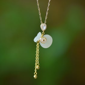 An Exquisite Sterling Silver-Gold Plated Inlaid White Jade Pendant