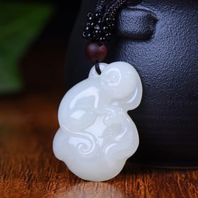 An Exquisite White Jade Monkey Pendant