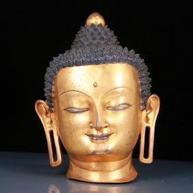 A Brilliant Gilt-Bronze Head Of Buddha Shakyamuni
