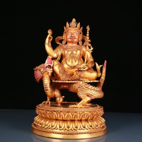 A solemn gilt bronze statue of Mammon