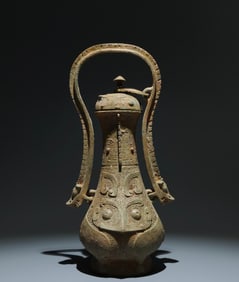 An Archaic Bronze Beast-Face Pattern Ewer