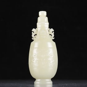 An exquisite white jade amphora with animal patterns