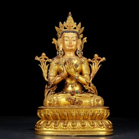 An exquisite gilt bronze statue of Tara inlaid with hundreds of treasures