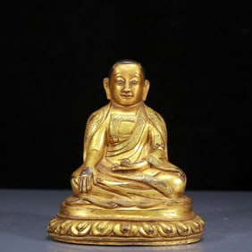 A Solemn Gilt Bronze Statue of Guru