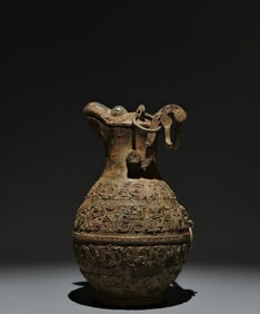 An Archaic Bronze Hollow Chi-Dragon Pattern Bird-head Cover Pot,With Inscription
