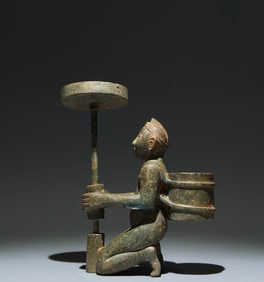 An Archaic Bronze Figure-Shaped Candlestick