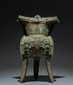 An Archaic Bronze Beast-Face Pattern Tripod Food Vessel