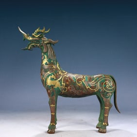 An Archaic Bronze Inlaid Gold and Silver Auspicious Beast Pattern Unicorn Ornament