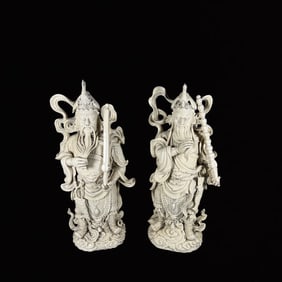 A Pair of Solemn Blance-De-Chine Statue of Mammon