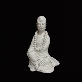 A Solemn Blance-De-Chine Statue of Dharma