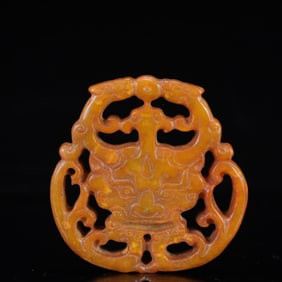 A Rare Gaogu yu Beast-Face Pendant