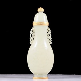 An exquisite white jade amphora with gold dragon and phoenix patterns