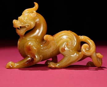 An Exquisite White Jade Auspicious Beast Ornament