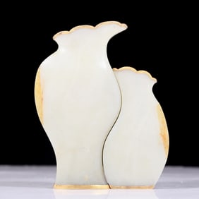 An exquisite white jade bottle covered with gold