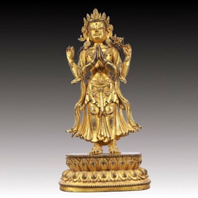 A Solemn Gilt Bronze Statue of Four-Armed Guanyin