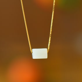An Exquisite Sterling Silver-Gold Plated Inlaid White Jade Pendant