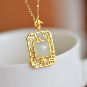 An Exquisite Sterling Silver-Gold Plated Inlaid White Jade Pendant